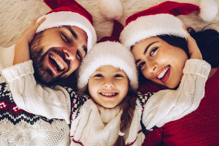 Smiling family with Christmas toques